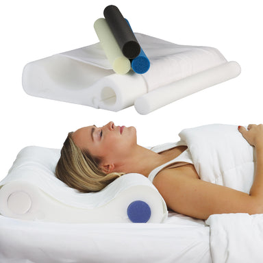 Double Core Select Foam Cervical Pillow system with removable cylindrical inserts in multiple firmness levels, shown supporting a woman lying on her back in bed for proper neck and spine alignment. The contoured white pillow cradles the head while interchangeable foam rolls customize support for sleep comfort and ergonomic positioning.